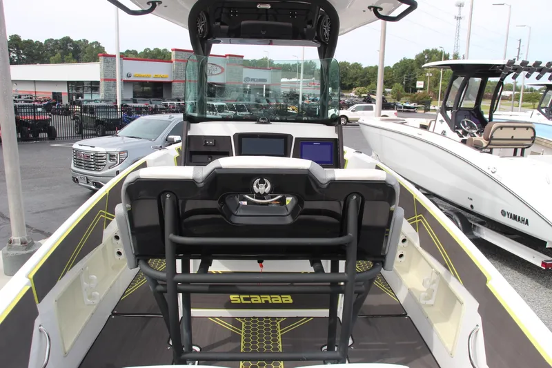 Slide: The Image of 2023 Scarab 255 Open ID boat interior with modern dashboard and seating. - 10