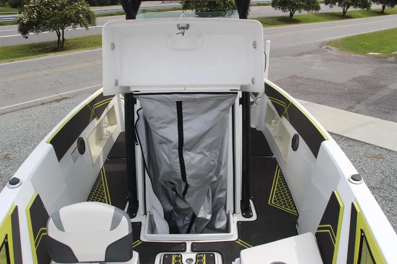 Slide: The Image of 2023 Scarab 255 Open ID boat interior with storage compartment open. - 15