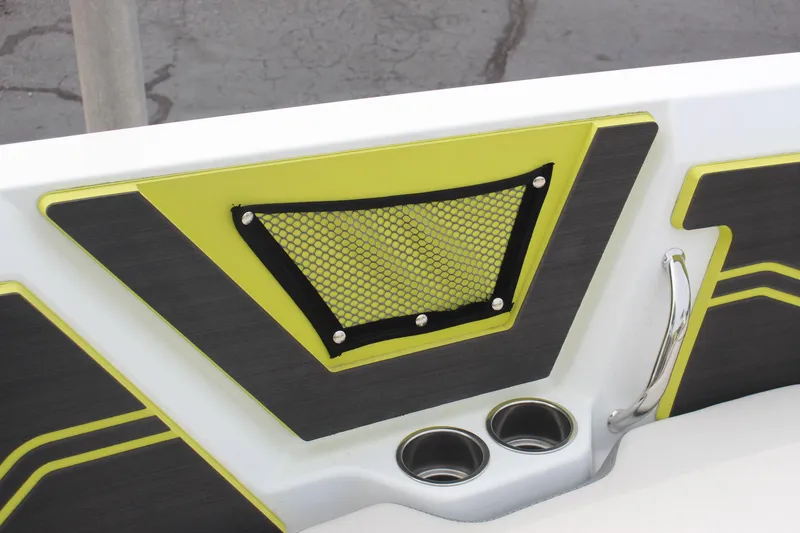 Slide: The Image of 2023 Scarab 255 Open ID boat interior with cup holders and storage net. - 18