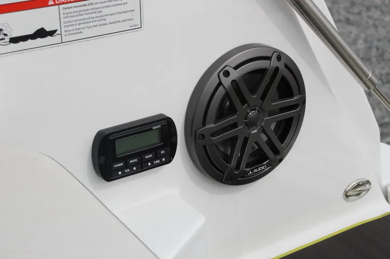 Slide: The Image of 2023 Scarab 255 Open ID boat audio system with speaker and control panel. - 19