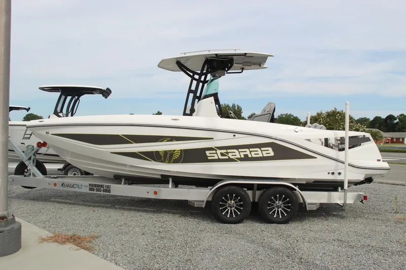 Slide: The Image of 2023 Scarab 255 Open ID boat on trailer, side view. - 2