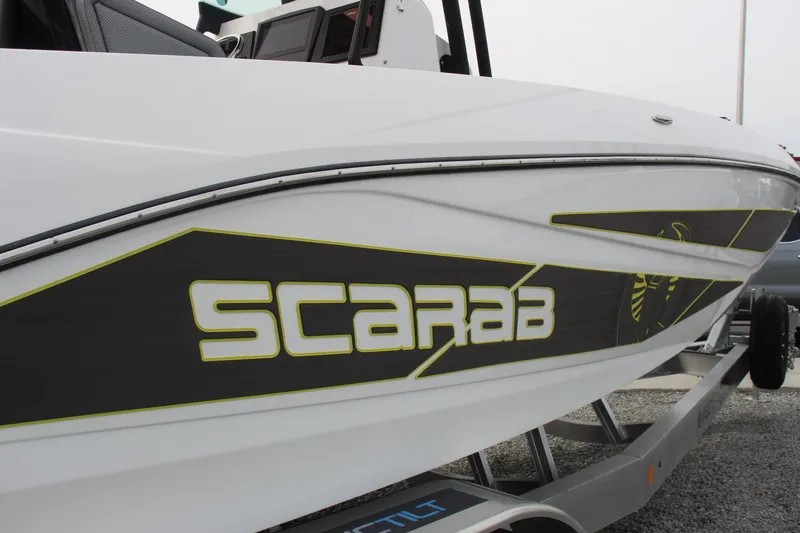Slide: The Image of 2023 Scarab 255 Open ID boat on trailer, side view. - 6