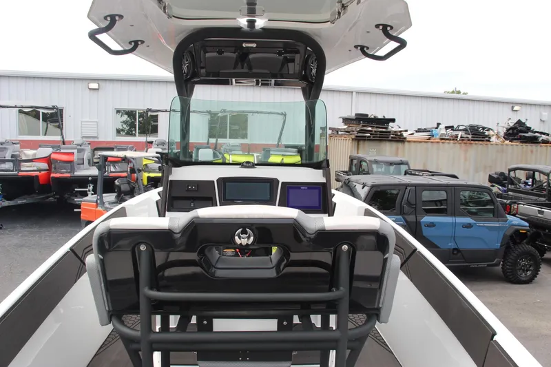 Slide: The Image of 2023 Scarab 255 Open ID boat interior with modern dashboard and controls. - 13