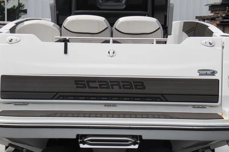 Slide: The Image of 2023 Scarab 255 Open ID boat rear view with logo and seating. - 6
