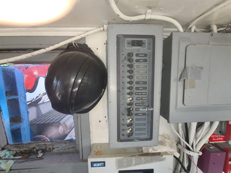 Slide: The Image of Electrical control panel inside a 1903 Johnson Brother Tug 64 boat cabin. - 25