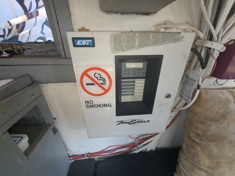 Slide: The Image of Fire alarm control panel on Johnson Brother Tug 64, 1903 model, with no smoking sign. - 26