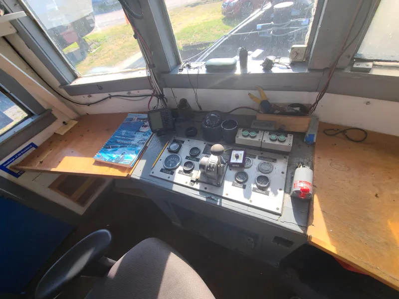 Slide: The Image of Control panel of a 1903 Johnson Brother Tug 64 boat with navigational instruments. - 30