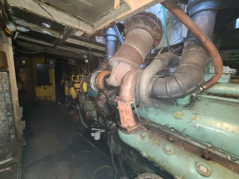 Slide: The Image of Engine room of a 1903 Johnson Brother Tug 64 with visible machinery. - 36