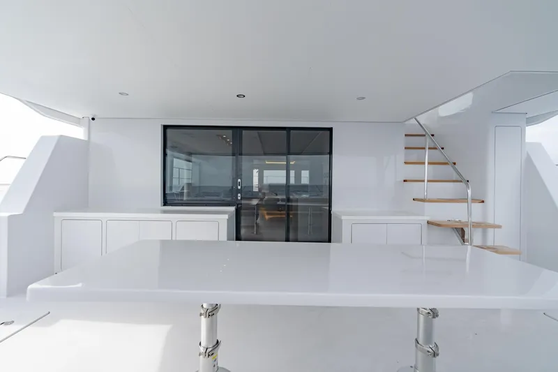 Slide: The Image of Modern interior of Two Oceans 555 yacht, 2025 model, featuring sleek design and staircase. - 16