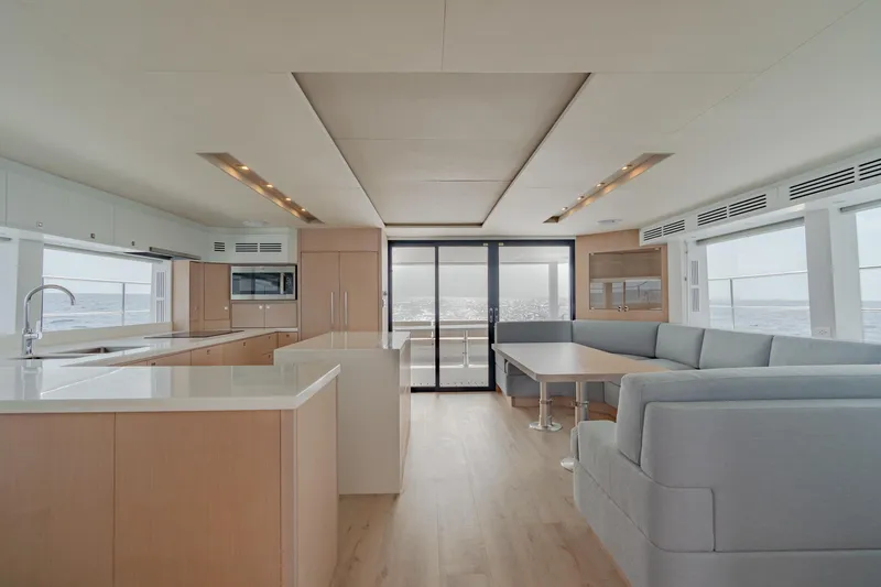 Slide: The Image of Modern interior of Two Oceans 555 yacht, 2025 model, featuring spacious kitchen and lounge area. - 31