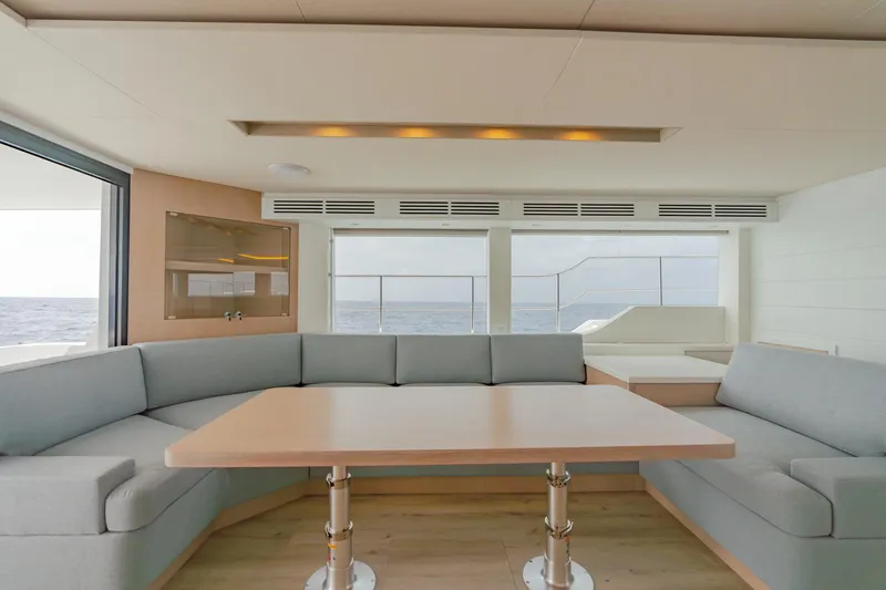 Slide: The Image of Modern interior of Two Oceans 555 yacht, 2025 model, featuring a spacious seating area and ocean view. - 32