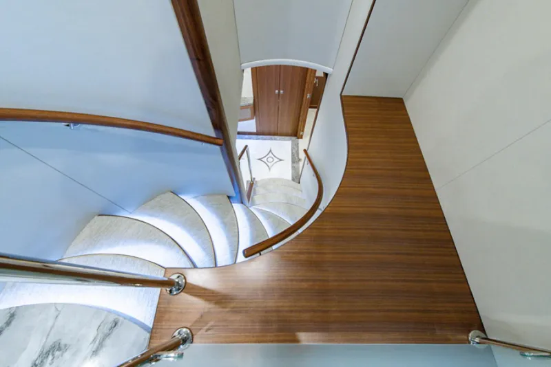 Slide: The Image of Spiral staircase in 2020 Hargrave G120 yacht with wooden and marble finishes. - 15