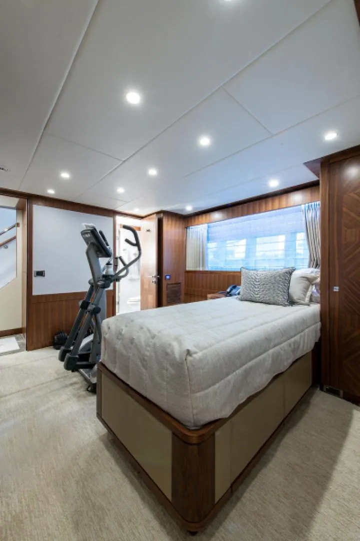 Slide: The Image of Luxurious bedroom with exercise equipment on a 2020 Hargrave G120 yacht. - 33