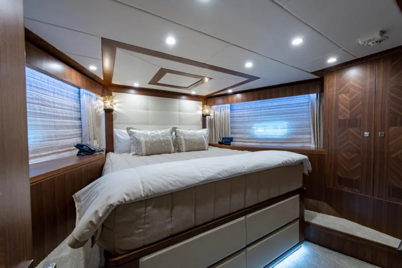 Slide: The Image of Luxurious bedroom interior of 2020 Hargrave G120 yacht with modern lighting and wood finishes. - 45