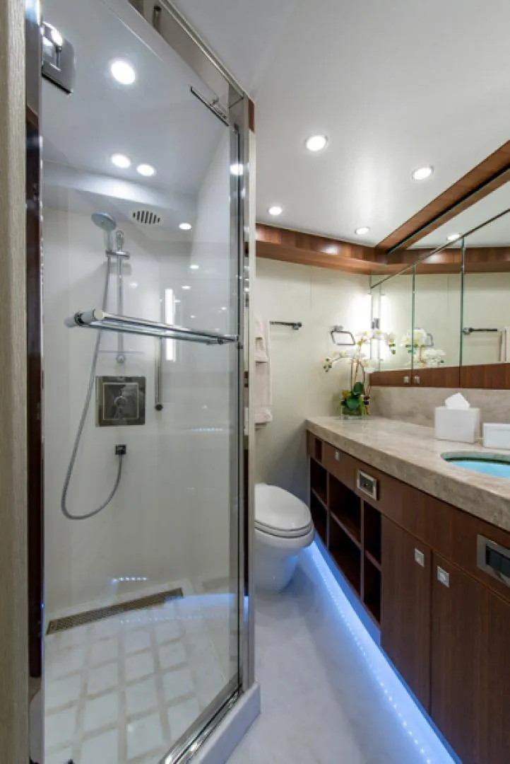 Slide: The Image of Modern bathroom in 2020 Hargrave G120 yacht with glass shower and wooden cabinetry. - 48