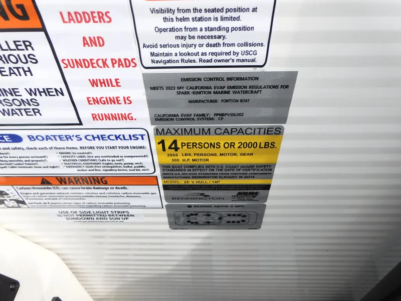 Slide: The Image of 2023 Bennington 25 RTFBA boat capacity and safety labels, maximum 14 persons or 2000 lbs. - 10