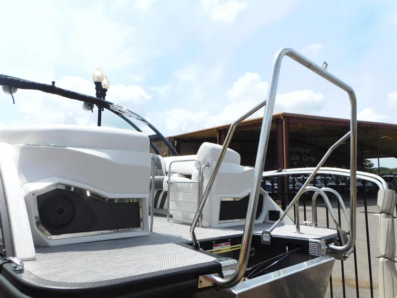 Slide: The Image of 2023 Bennington 25 RTFBA pontoon boat with modern seating and stainless steel railings. - 13