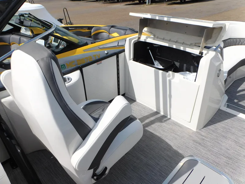 Slide: The Image of 2023 Bennington 25 RTFBA boat interior with storage compartment and seating. - 6