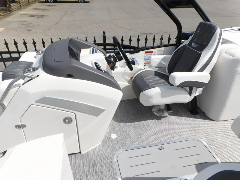 Slide: The Image of 2023 Bennington 25 RTFBA boat cockpit with captain's chair and control console. - 7