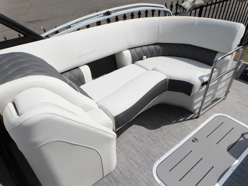 Slide: The Image of 2023 Bennington 25 RTFBA boat with luxurious white and gray seating. - 9