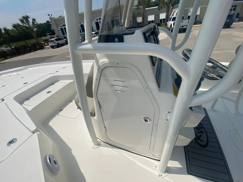Slide: The Image of 2024 Key West 230 Bay Reef boat console and deck area. - 11