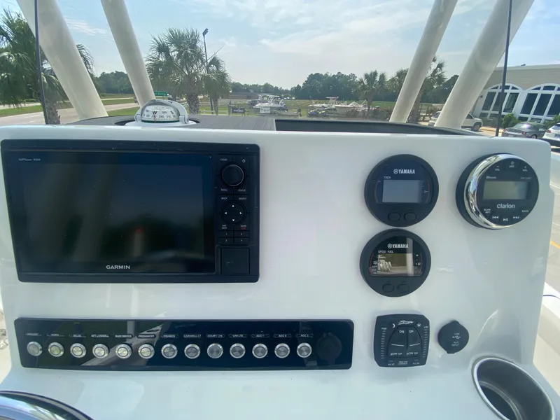 Slide: The Image of Dashboard of 2024 Key West 230 Bay Reef boat with Garmin navigation system. - 14