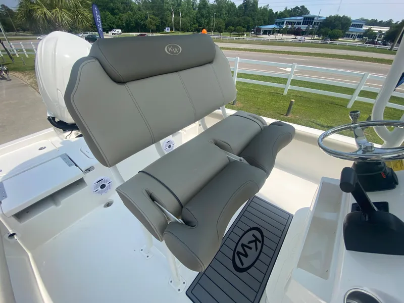 Slide: The Image of 2024 Key West 230 Bay Reef boat with comfortable seating and modern design. - 18