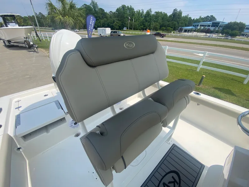 Slide: The Image of 2024 Key West 230 Bay Reef boat with gray seating and white deck. - 16