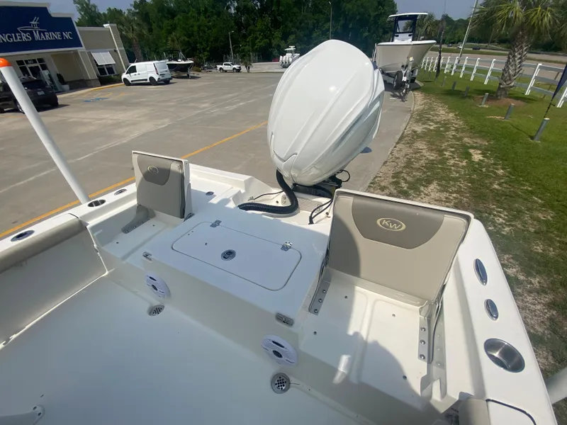 Slide: The Image of 2024 Key West 230 Bay Reef boat with outboard motor at dealership. - 20