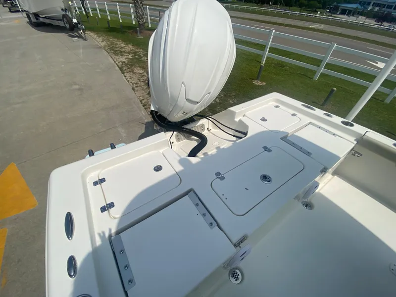 Slide: The Image of 2024 Key West 230 Bay Reef boat with outboard motor, rear deck view. - 21