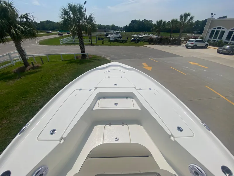 Slide: The Image of 2024 Key West 230 Bay Reef boat bow view at a marina. - 6