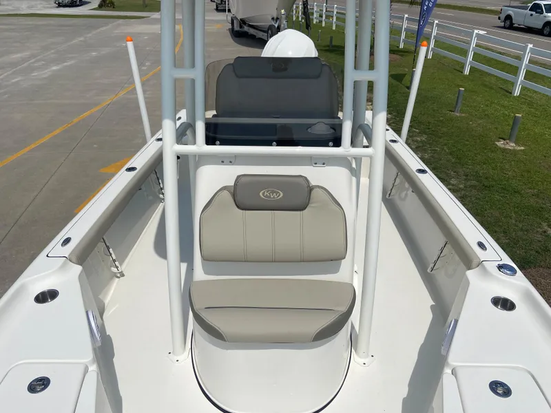 Slide: The Image of 2024 Key West 230 Bay Reef boat interior with seating and console. - 9