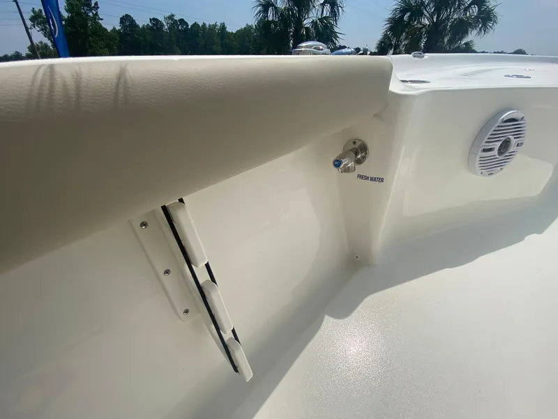 Slide: The Image of 2024 Key West 230 Bay Reef boat interior detail with speaker and rod holder. - 13
