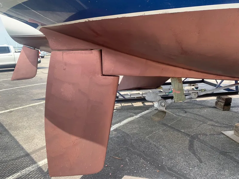 Slide: The Image of 1999 Catalina 36 Mark II sailboat keel and rudder in dry dock. - 10