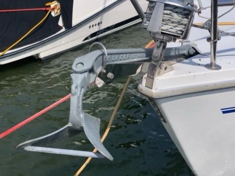 Slide: The Image of Anchor of a 1999 Catalina 36 Mark II sailboat docked in water. - 14