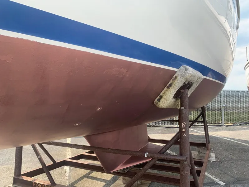 Slide: The Image of 1999 Catalina 36 Mark II sailboat hull on dry dock. - 9