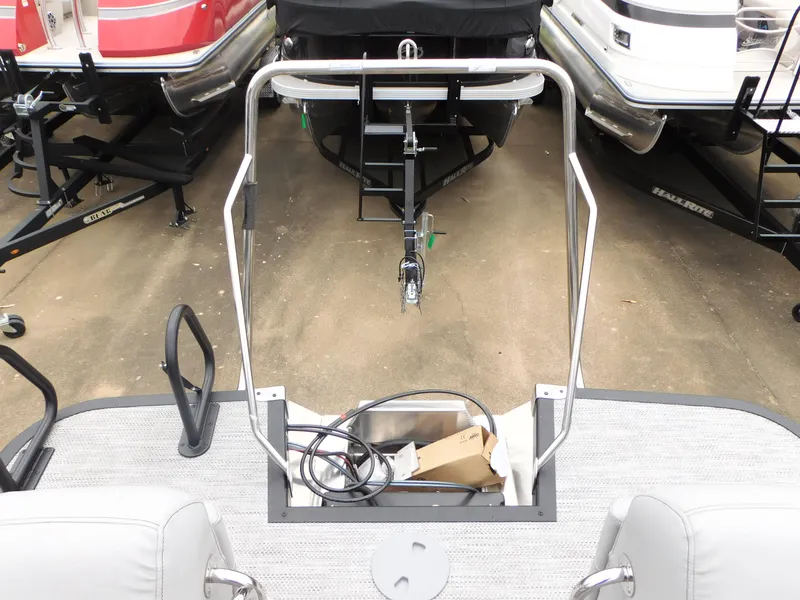 Slide: The Image of 2023 Bennington 24 LXSFBA pontoon boat rear view with trailer. - 11