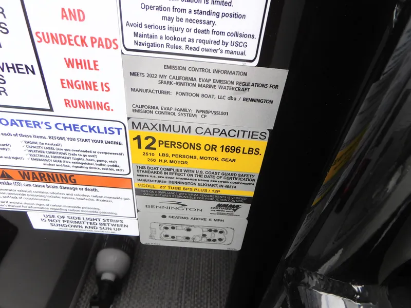 Slide: The Image of Capacity and safety labels on 2023 Bennington 24 LXSFBA pontoon boat. - 12