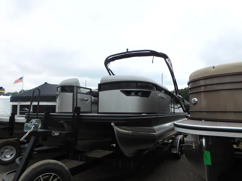 Slide: The Image of 2023 Bennington 24 LXSFBA pontoon boat on display. - 2
