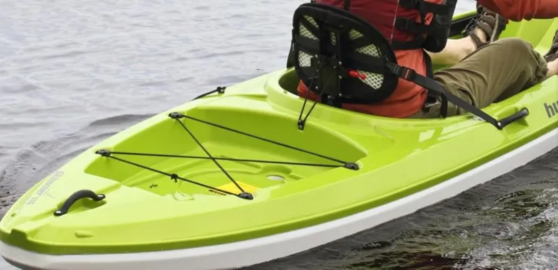 The Image of Bright green 2023 Hurricane Kayaks Skimmer 116 on water, featuring a comfortable seat and bungee storage. - 0