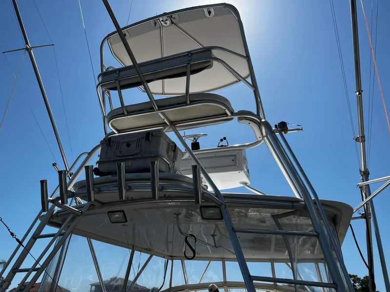 Slide: The Image of 2003 Ocean 40 Super Sport boat tower against clear blue sky. - 21