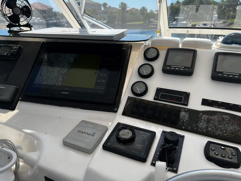 Slide: The Image of Control panel of a 2003 Ocean 40 Super Sport boat with Garmin navigation system. - 34