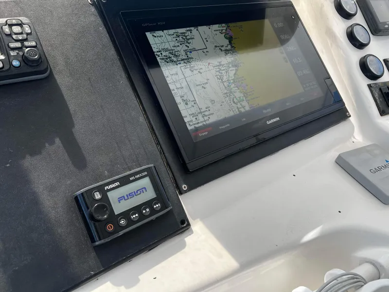 Slide: The Image of Control panel of a 2003 Ocean 40 Super Sport with Garmin navigation system. - 35