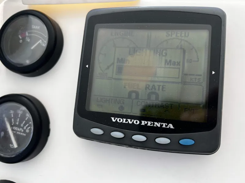 Slide: The Image of Volvo Penta display and gauges on 2003 Ocean 40 Super Sport boat dashboard. - 36