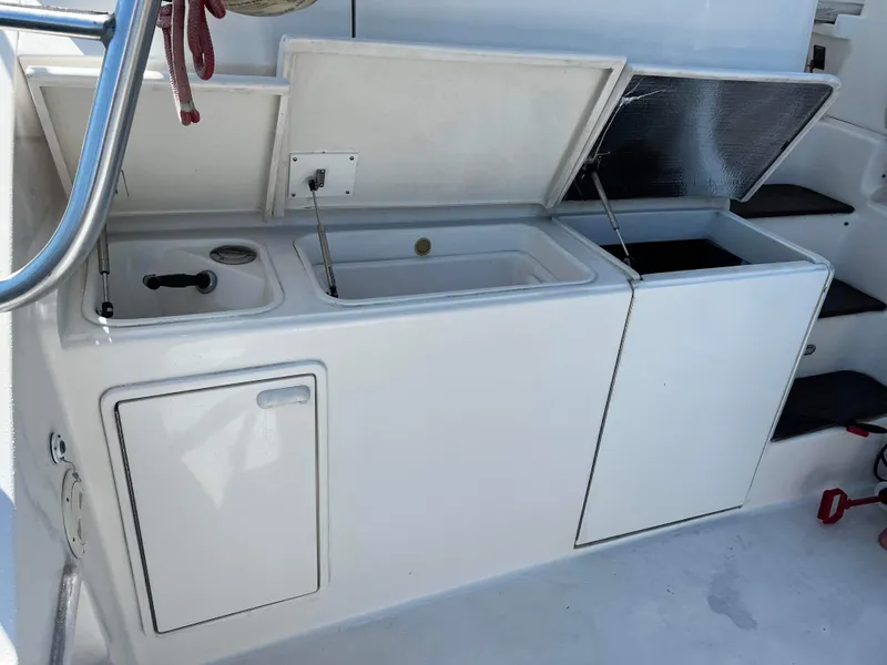 Slide: The Image of 2003 Ocean 40 Super Sport yacht interior with open storage compartments and steps. - 39