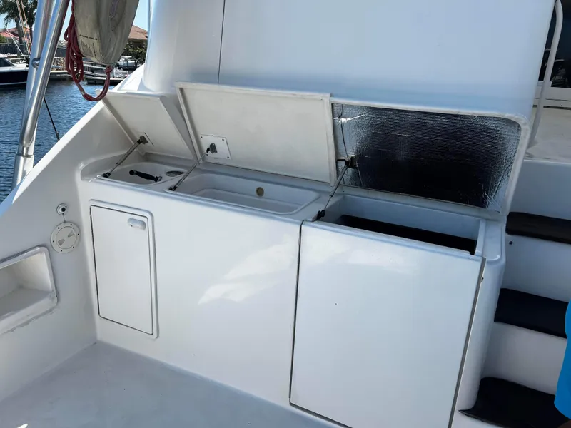 Slide: The Image of 2003 Ocean 40 Super Sport yacht with open storage compartments on deck. - 40