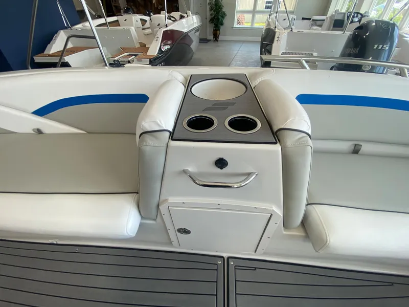 Slide: The Image of 2024 Starcraft SVX 211 boat interior with cup holders and seating. - 14