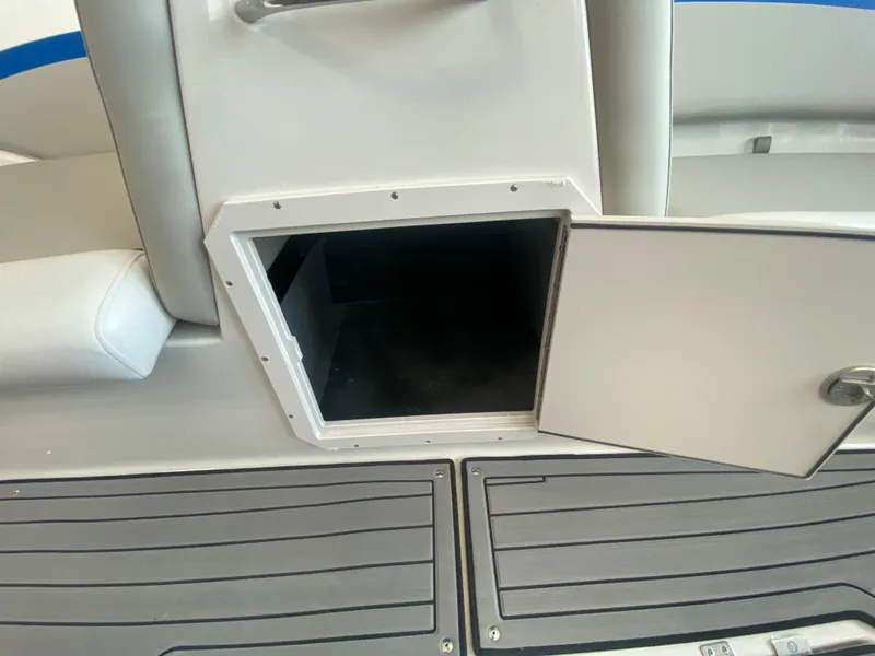 Slide: The Image of Open storage compartment on a 2024 Starcraft SVX 211 boat. - 15