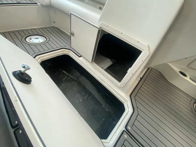 Slide: The Image of 2024 Starcraft SVX 211 boat interior storage compartments and deck. - 16