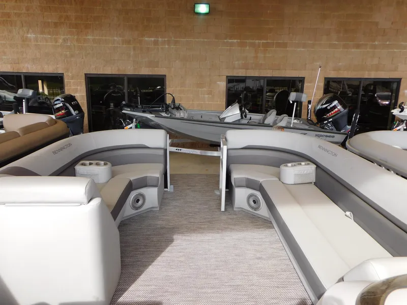 Slide: The Image of 2023 Bennington 22 SXL pontoon boat interior with plush seating and modern design. - 3